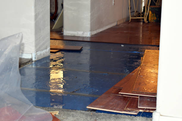 Professional Flood Damage Restoration technician working in Rumford, RI